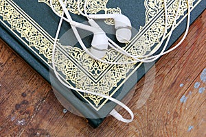 Koran islamic holy book with headset concept