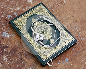Koran islamic holy book with headset concept