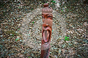 Korea`s smiling male totem pole in Sanjeong Lake of Pocheon, South Korea.