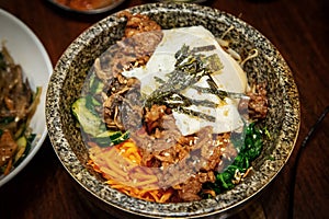 Korean bibimbap dish in traditional hot stone bowl