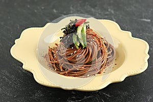 Korean Buckwheat Bibim Guksu. Traditional Stir Fry Cold Noodle