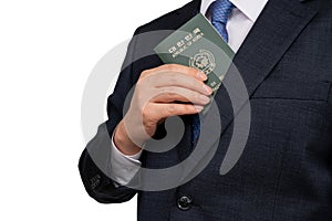 Korean businessman holding a Korean passport in hand