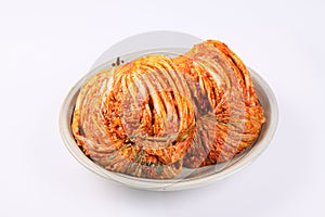 Korean cabbage kimchi on plate on white background