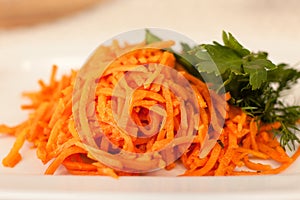 Korean carrot salad. Close-up. Carrots and parsley