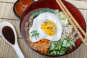 Korean cuisine, beef Bibimbap in red bowl