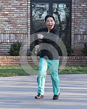 Korean doctor running down her driveway