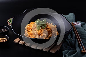 Korean dry noodle in black bowl