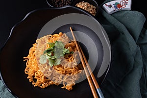 Korean dry noodle in black bowl