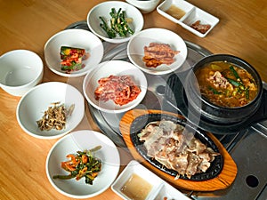 Korean grilled sliced meat and soy bean paste soup with side dishes