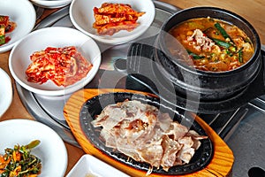 Korean grilled sliced meat and soy bean paste soup with side dishes