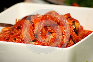 Korean Kimchi in white bowl photo