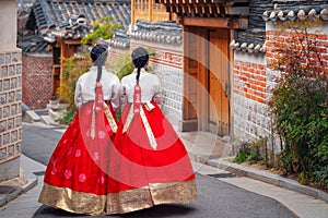 Korean lady in Hanbok or Korea dress and walk in an ancient town in seoul