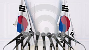 Korean official press conference. Flags of South Korea and microphones. Conceptual 3D rendering