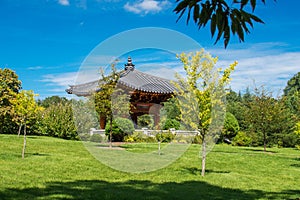 Korean pagoda and the bell of harmony in the summer park