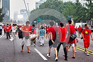 Korean people in red on street for festivity event