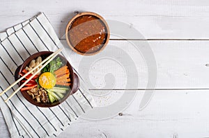 Korean rice dish Bibimbap. Usually served as a bowl of warm white rice topped with vegetables and egg. Top view