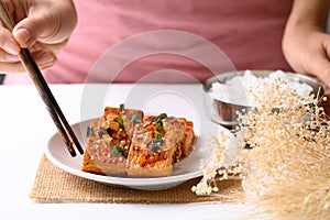 Spicy braised tofu (Dubu Jorim) eating with cooked rice, Korean side dish