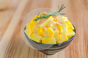 Korean style fresh mango shaved ice on wood table .