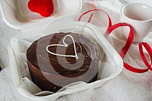Korean style shocolate bento cake on light background. Cake for Valentine's Day, Mother's Day, or Birthday