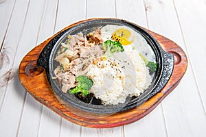 Korean-style teppanyaki with rice, eggs, vegetables, and grilled meat