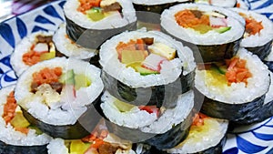 Korean sushi rolls kimbap or gimbap cut into small slices photo