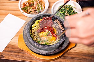 Korean traditional dish- bibimbap mixed rice with vegetables Include beef and fried egg