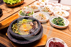 Korean traditional dish- bibimbap mixed rice with vegetables Include beef and fried egg and pickles set