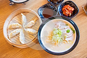 Korean traditional dumplings and soy milk noodle soup, Kong-Guksu served with kimchi and soy sauce