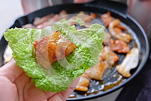 Korean traditional grilled BBQ food, samgyupsal, pork in Lettuce with side dishes, Food for camping in winter