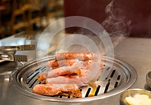 Korean traditional pork barbecue food on a grill in restaurant