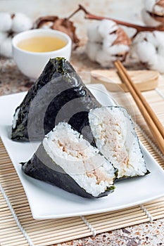 Korean triangle kimbap Samgak with nori, rice and tuna fish, similar to Japanese rice ball onigiri. Vertical