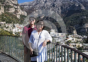Korean woman and her caucasian senior husband on holiday on the way to Positano,