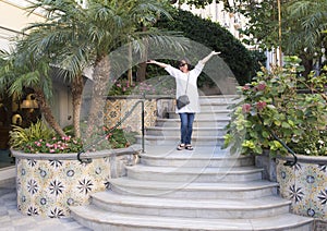 Korean woman on holiday enjoying the beauty of the Grand Hotel La Favorita, Sorrento