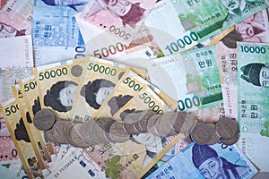 Korean won currency. Various types of bank notes and coins lined up