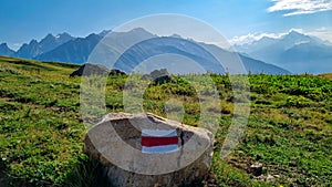 Koruldi Lake Trek -  A trail mark with panoramic view on the Svaneti mountain range, Caucasus, Georgia.