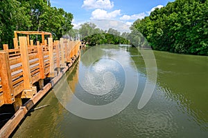 Korzo Zalesie - area for leisure activities with wooden bridge walk by Little Danube river in village of Zalesie SLOVAKIA