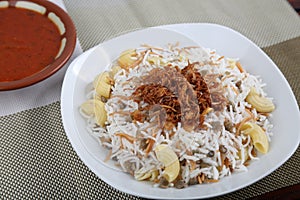 Koshari With Spicy Daqoos riceserved in a dish isolated on table side view of middle east food