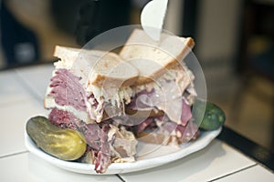 Kosher deli combination sandwich pastrami corned beef tongue cole slaw and Russian dressing