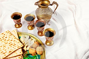 Kosher wine cup, matzah flatbread at passover embracing a jewish pesach attributes