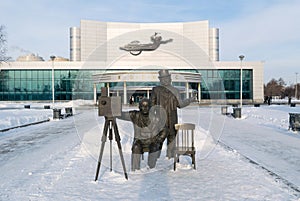 Kosmos theatre and Lumiere brothers sculpture in winter photo