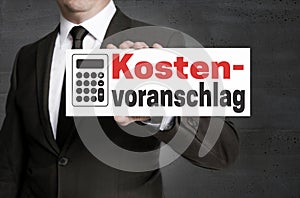 Kostenvoranschlag in german Cost estimate signboard is held by