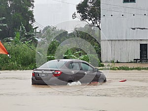 Outdoor scenery during raining season with flash flood at Menggatal Road.