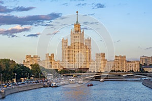 Kotelnicheskaya Embankment Building one of seven Stalin skyscrapers and Moskva river at sunset, Moscow, Russia