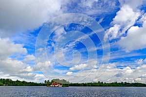 Kothduwa temple, or Koth Duwa Raja Maha Viharaya, Buddhist temple, Madu Ganga clouds with dark blue sky. Bentota river, Sri Lanka