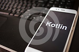 Kotlin Programming language for mobile development, concept. Smartphone