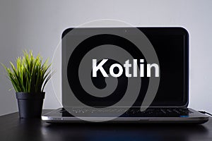 Kotlin programming language. Programming training, the concept of computer courses. Laptop on the table
