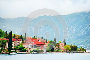 Kotor bay, Montenegro. Small town with old architecture and trees