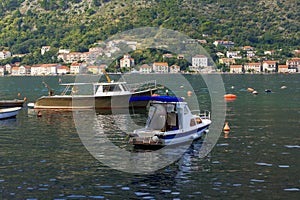 Kotor, Montenegro boats and high mountains