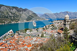 Kotor, Montenegro, Europe. Bay of Kotor on Adriatic Sea. Church, roofs of the historical buildings in the old town. Bay