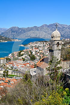 Kotor, Montenegro, Europe. Bay of Kotor on Adriatic Sea. Church, roofs of the historical buildings in the old town. Bay